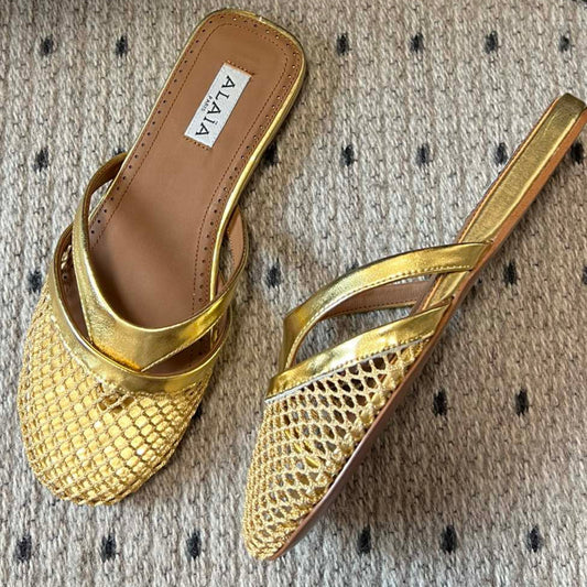 Alaia 25 Mules Planas de Red de Pescado Infradito en Oro de Piel de Cordero 303709