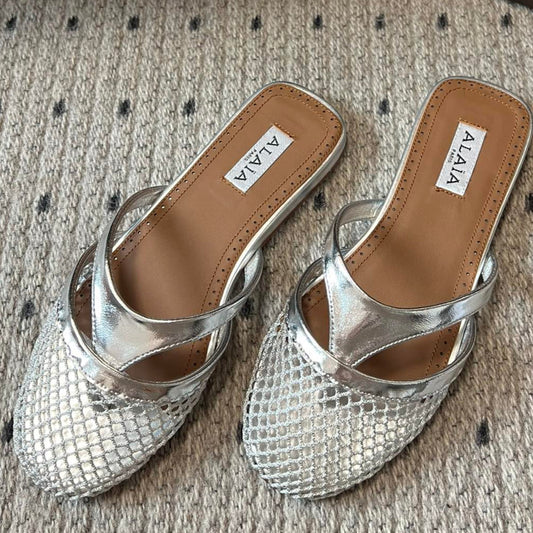 Alaia 25 Mules Planas de Red Plateada de Piel de Cordero 303712