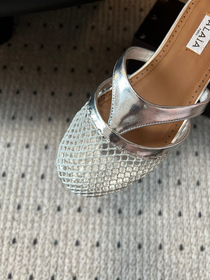 Alaia 25 Mules Planas de Red Plateada de Piel de Cordero 303712